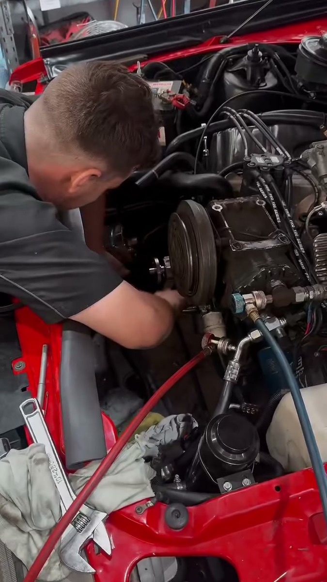 Elite Fleet Auto technician working on a customer vehicle in the Cannonvale workshop